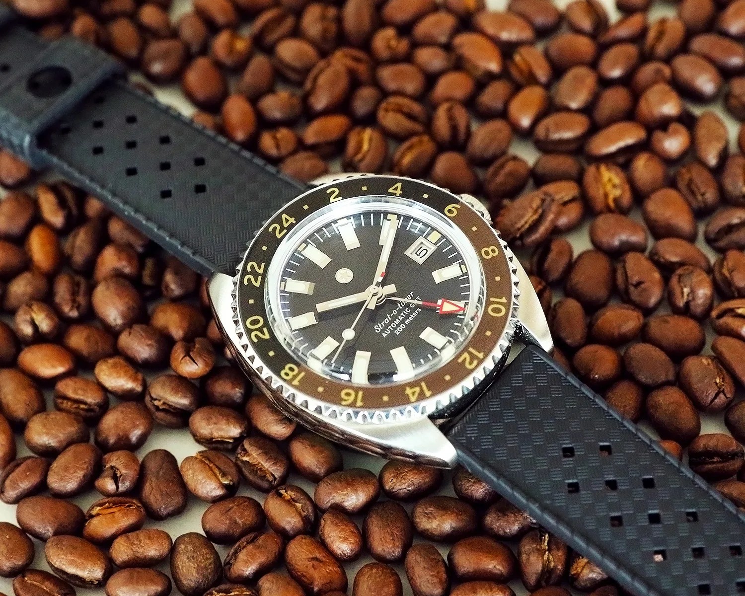 a jack mason watch on some coffee beans