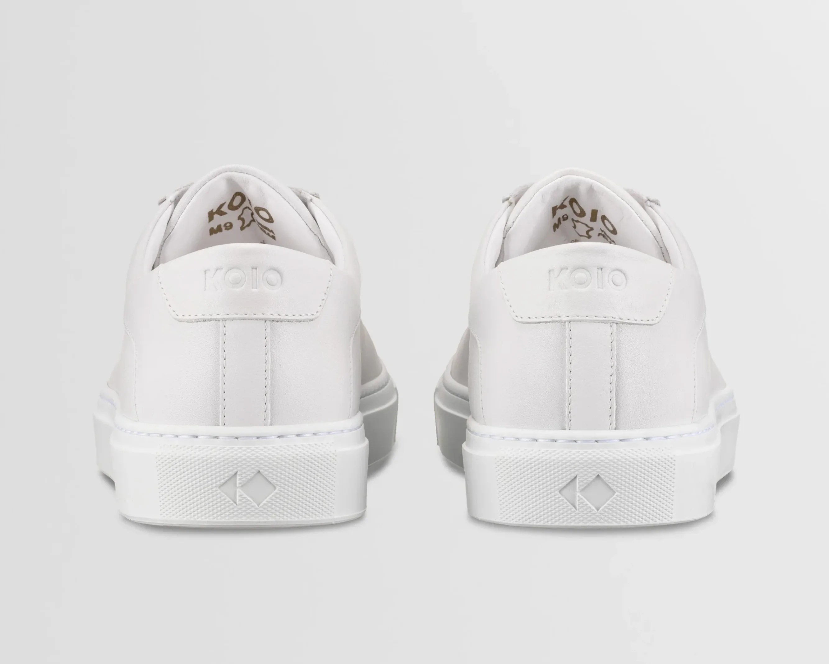 back view of a pair of white sneakers