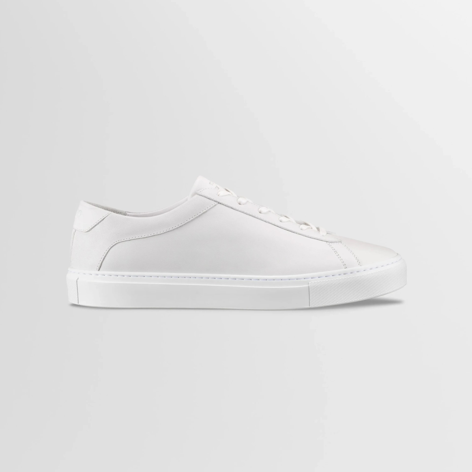 one white leather sneaker