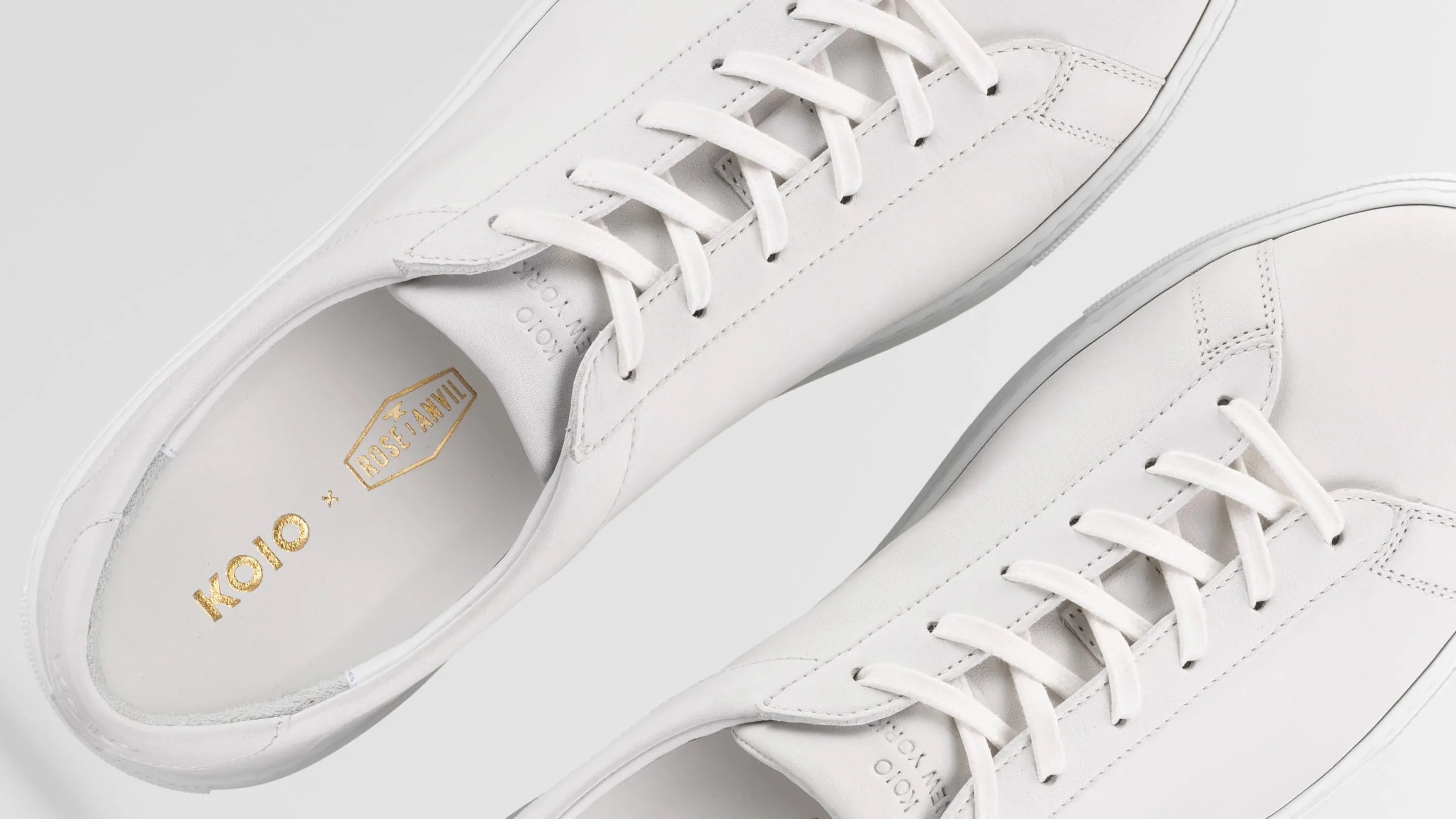 a pair of white sneakers from the top