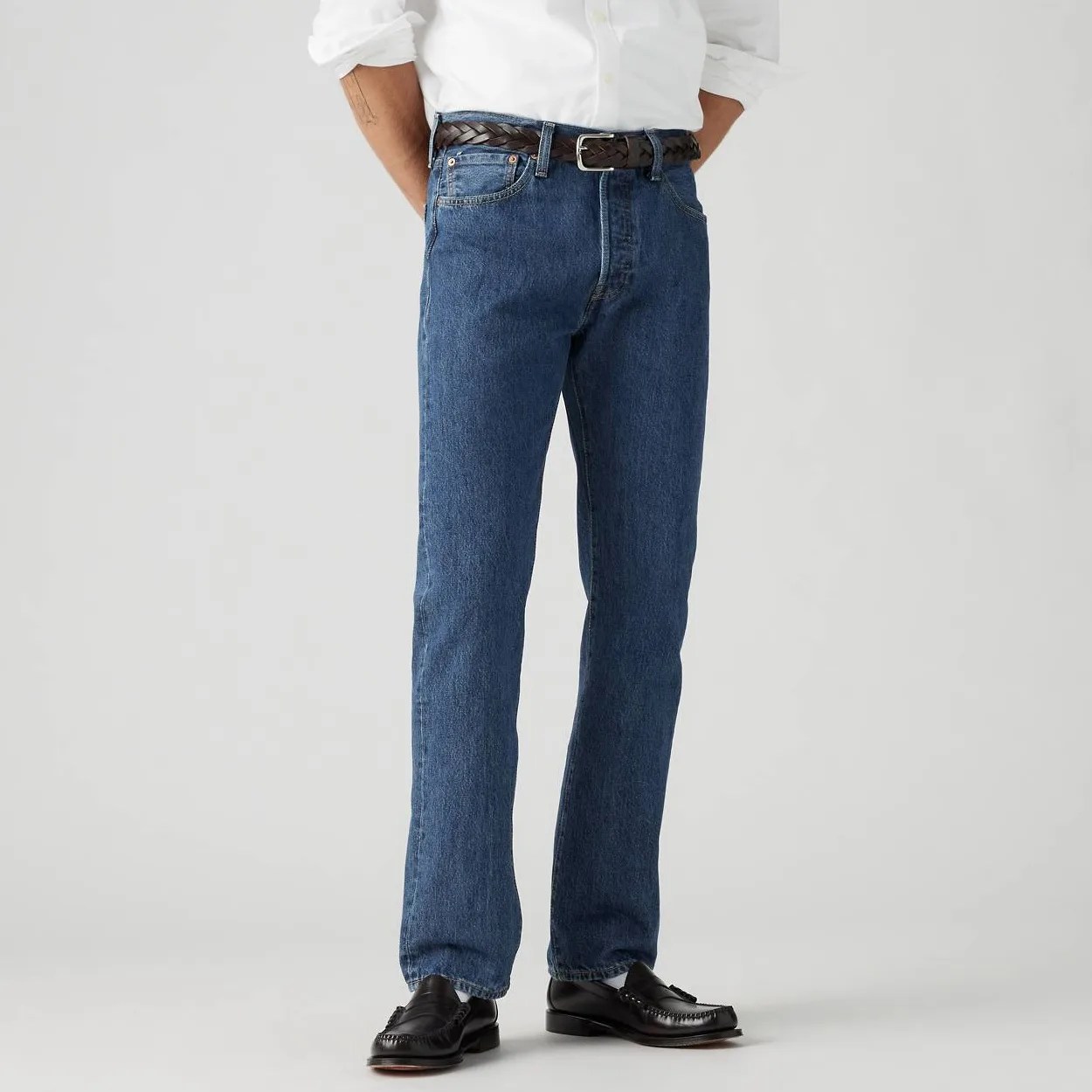 A man in jeans, from the waist down.