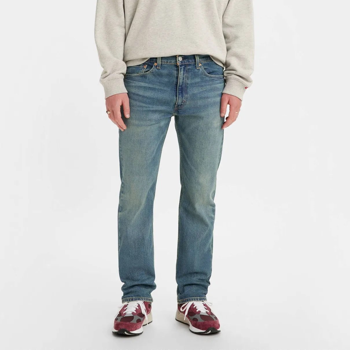 A man in jeans, from the waist down.