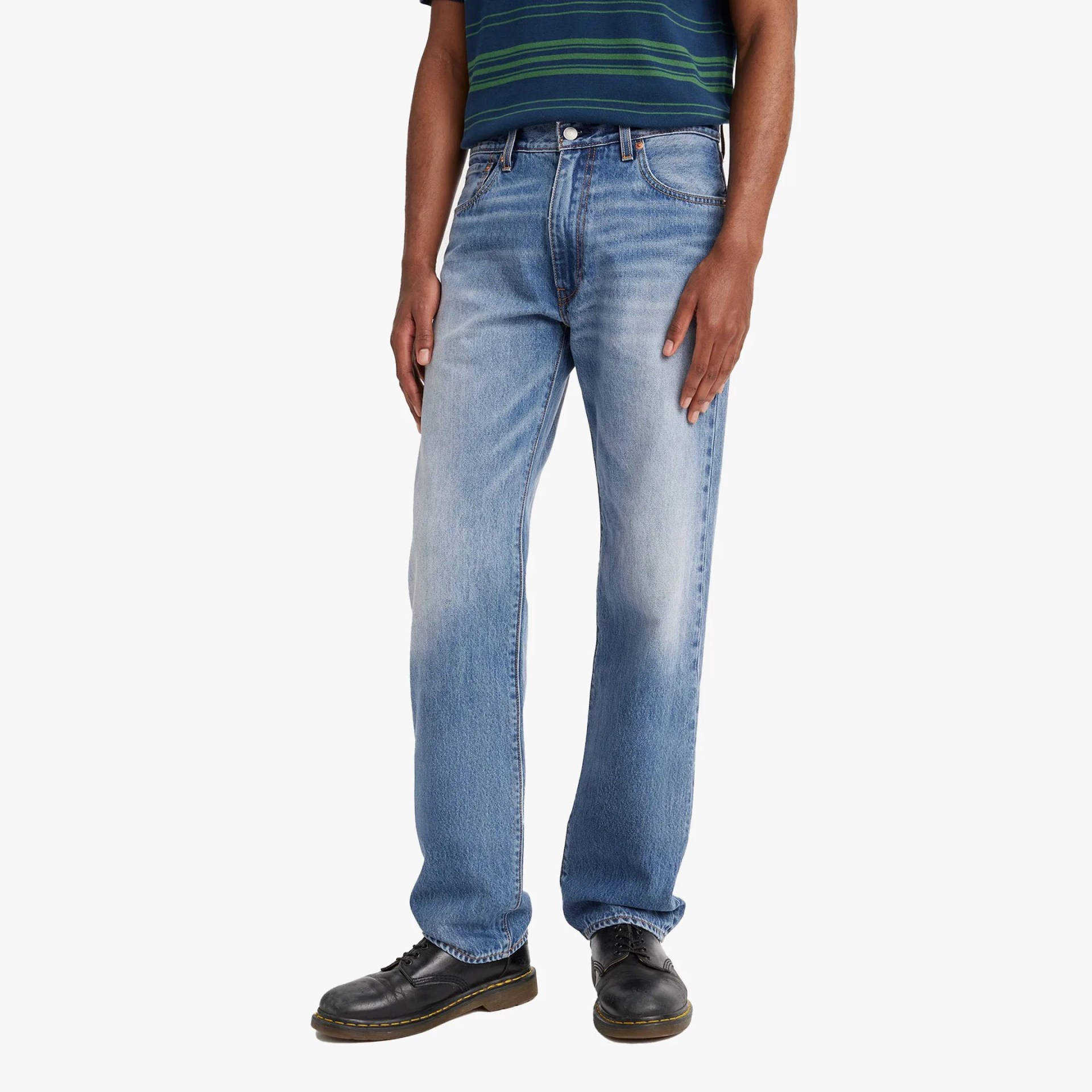 A man in jeans from the waist down.