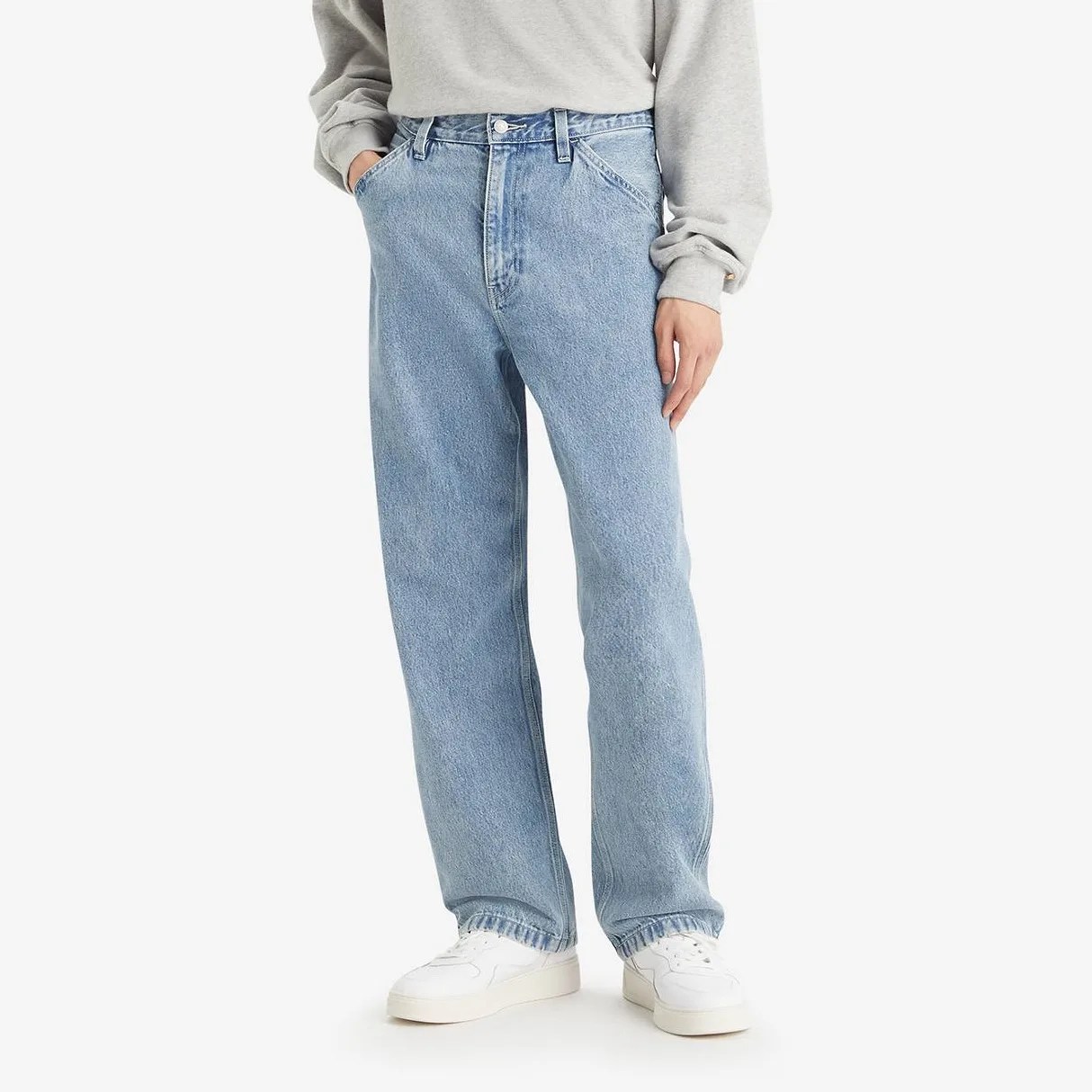 A man in jeans from the waist down.
