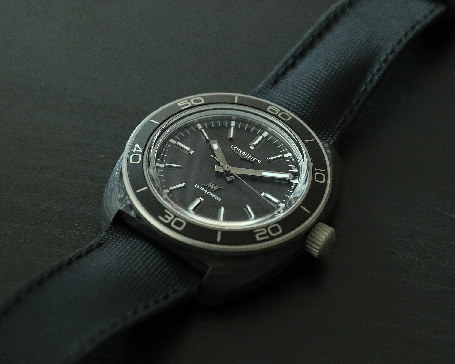 a longines watch on a table