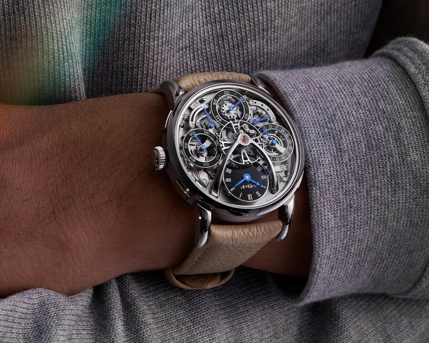 an mb and f watch on a mans wrist