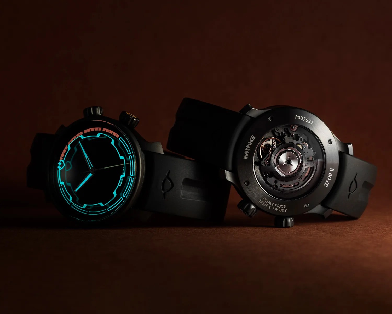 two MING dive watches with one facing forward and one backward