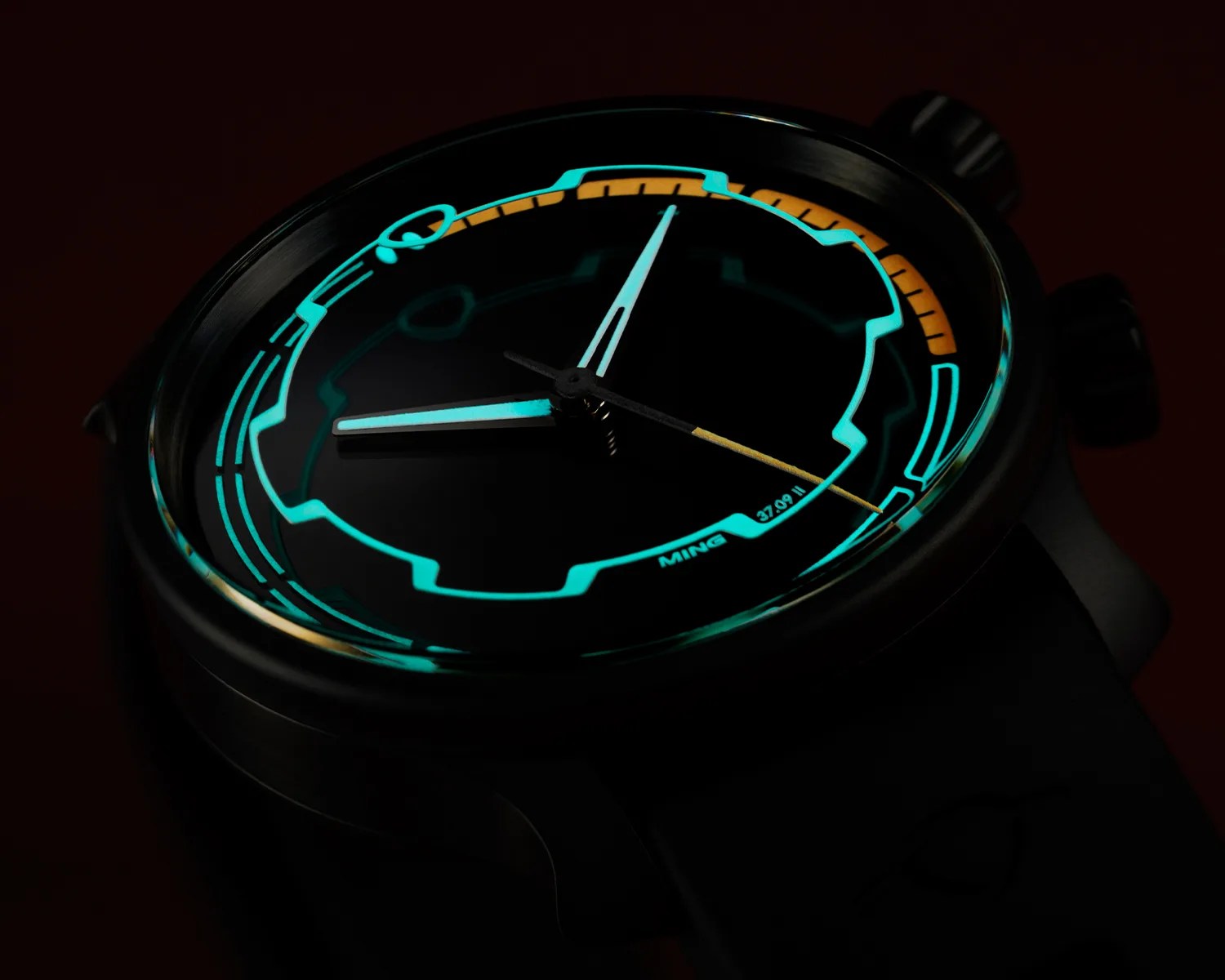 a closeup of a MING watch dial glowing in the dark