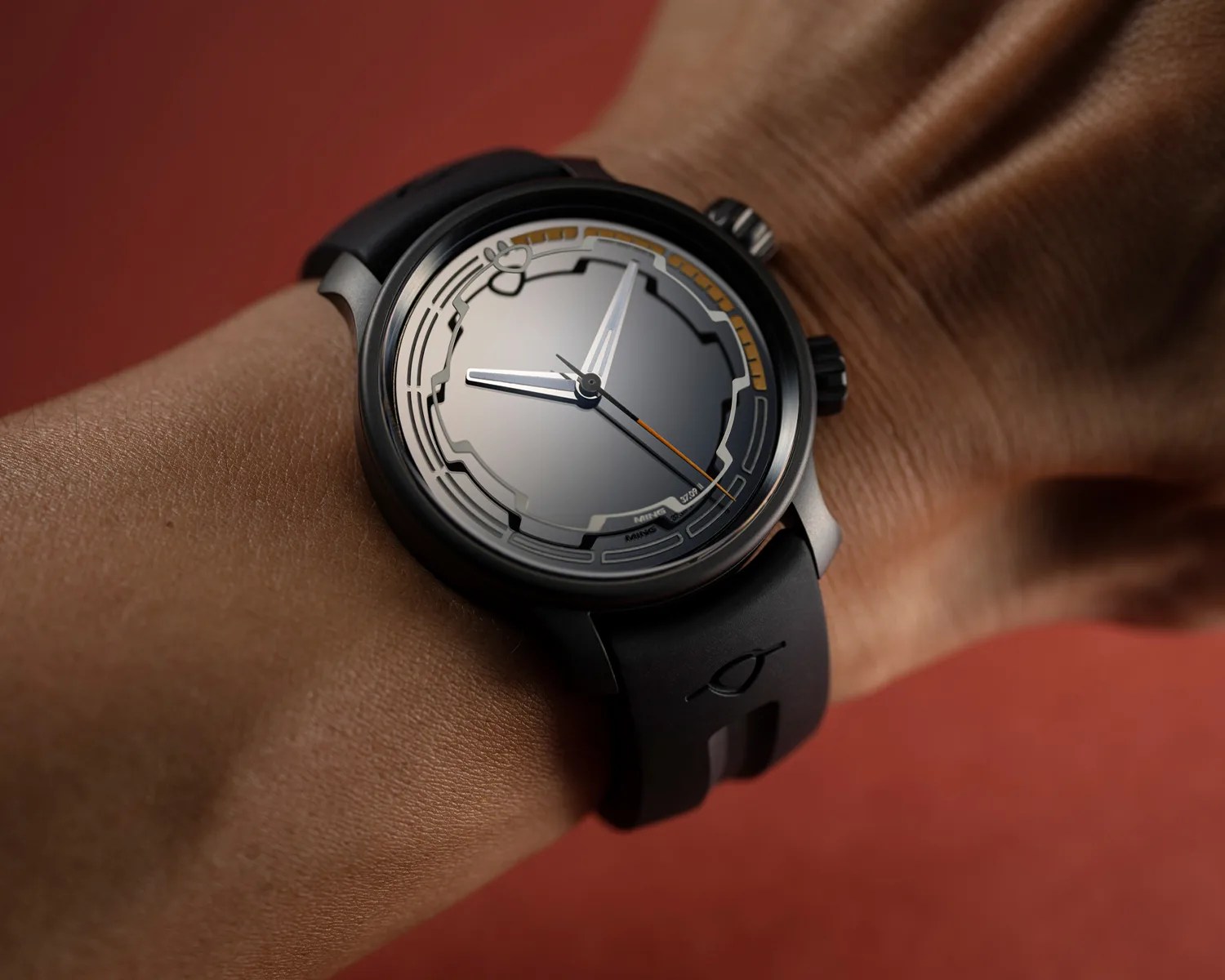 a MING dive watch on a mans wrist
