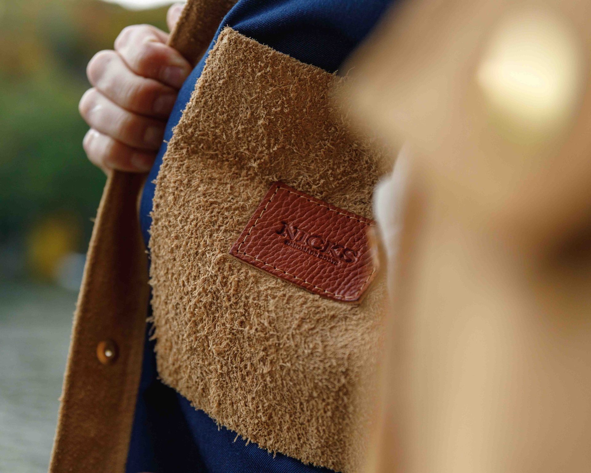 inside pocket of a brown leather jacket