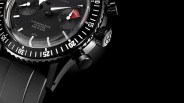 a closeup of a black nivada chronograph watch