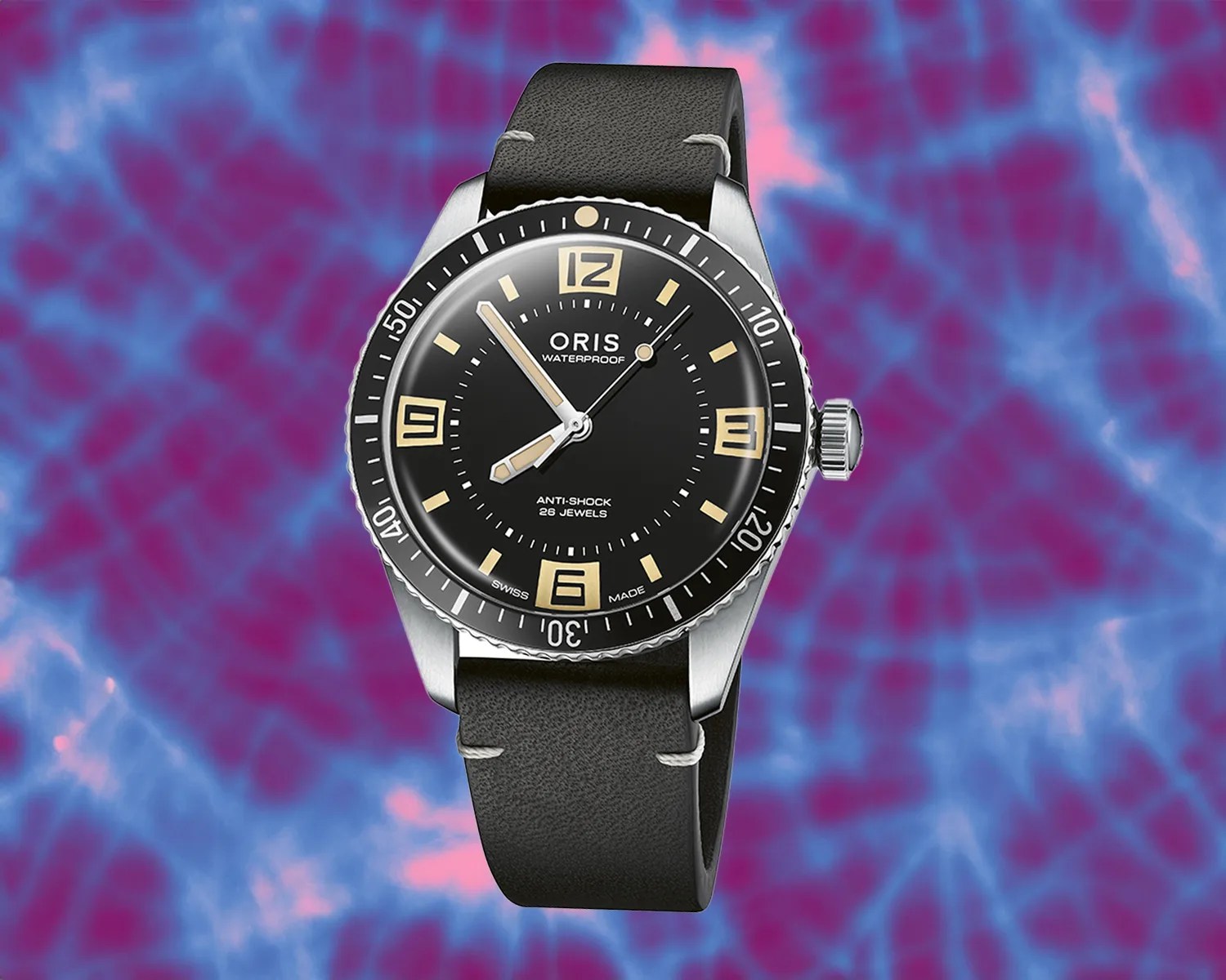 an oris dive watch against a tie dye background