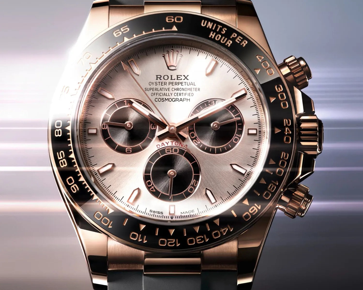 a gold rolex daytona watch in motion