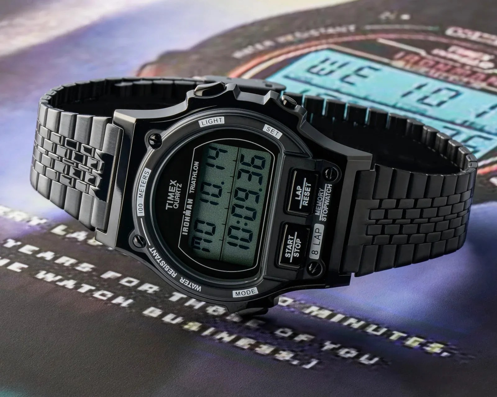 A digital watch sitting on a magazine