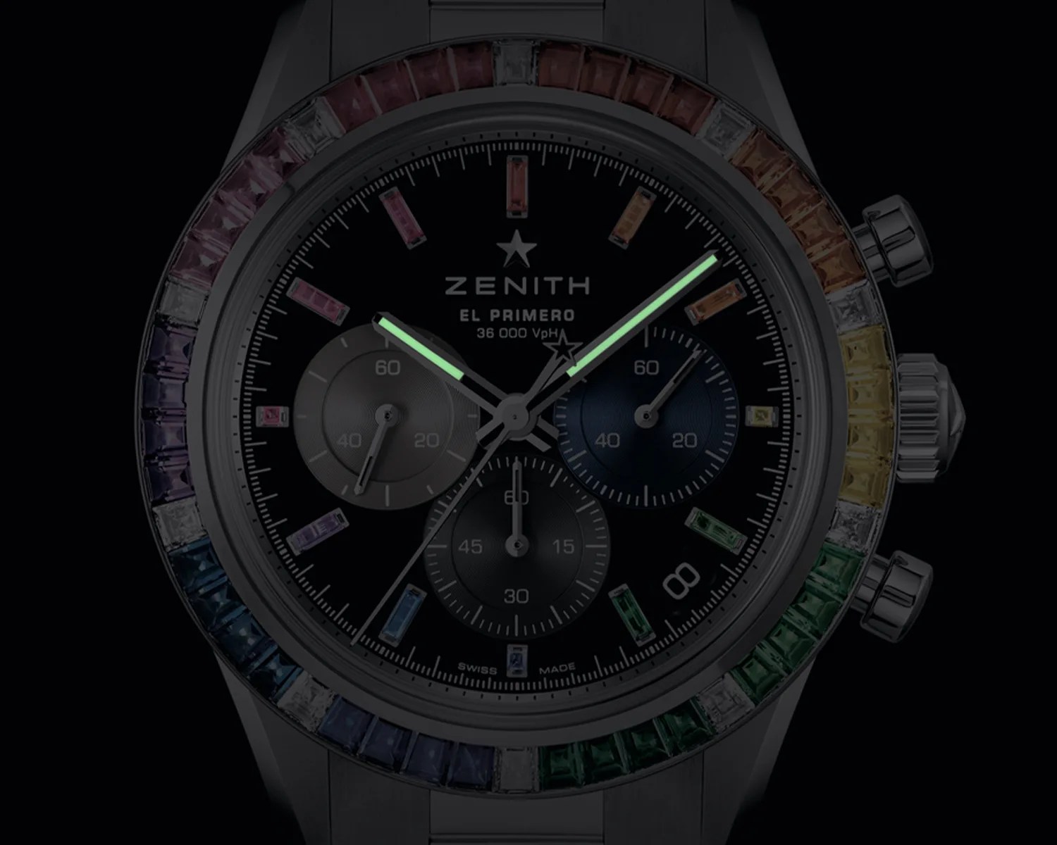 a zenith watch dial with hands glowing in the dark