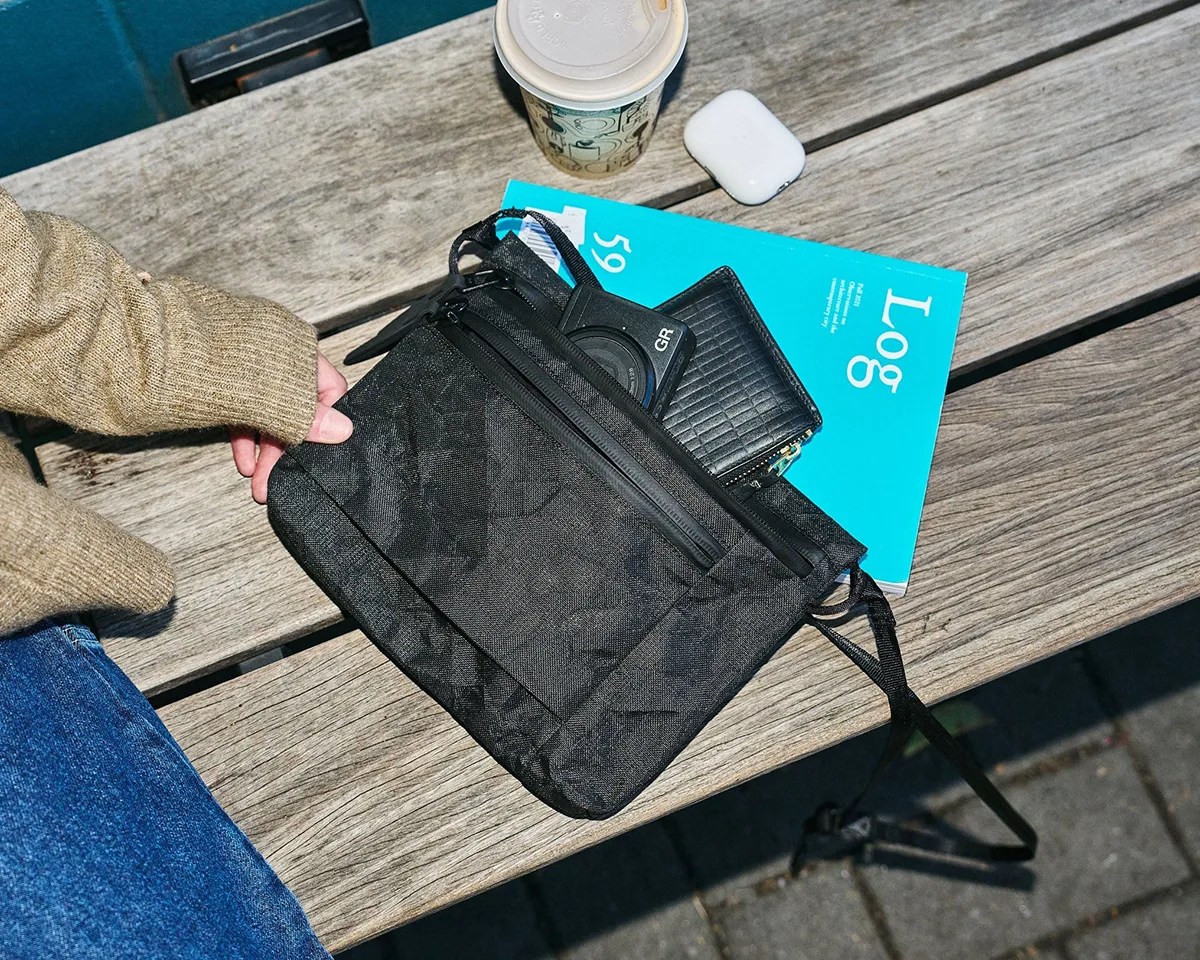 Aer Simple Pouch on bench with various items surrounding it