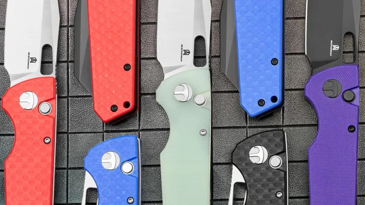 Closeup of Bestechman Guardian knives on black grid background