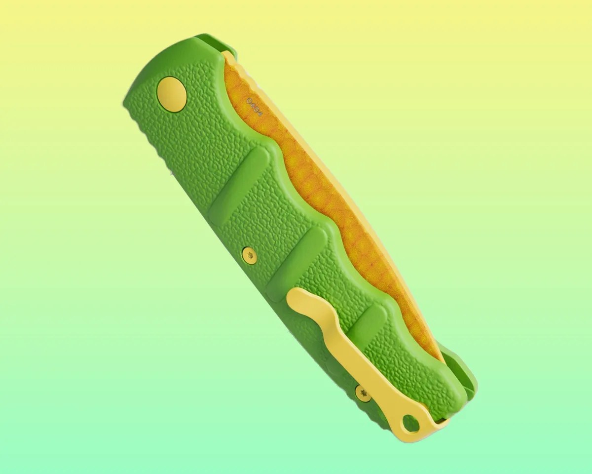 Böker KalashniCob knife closed on green-yellow background