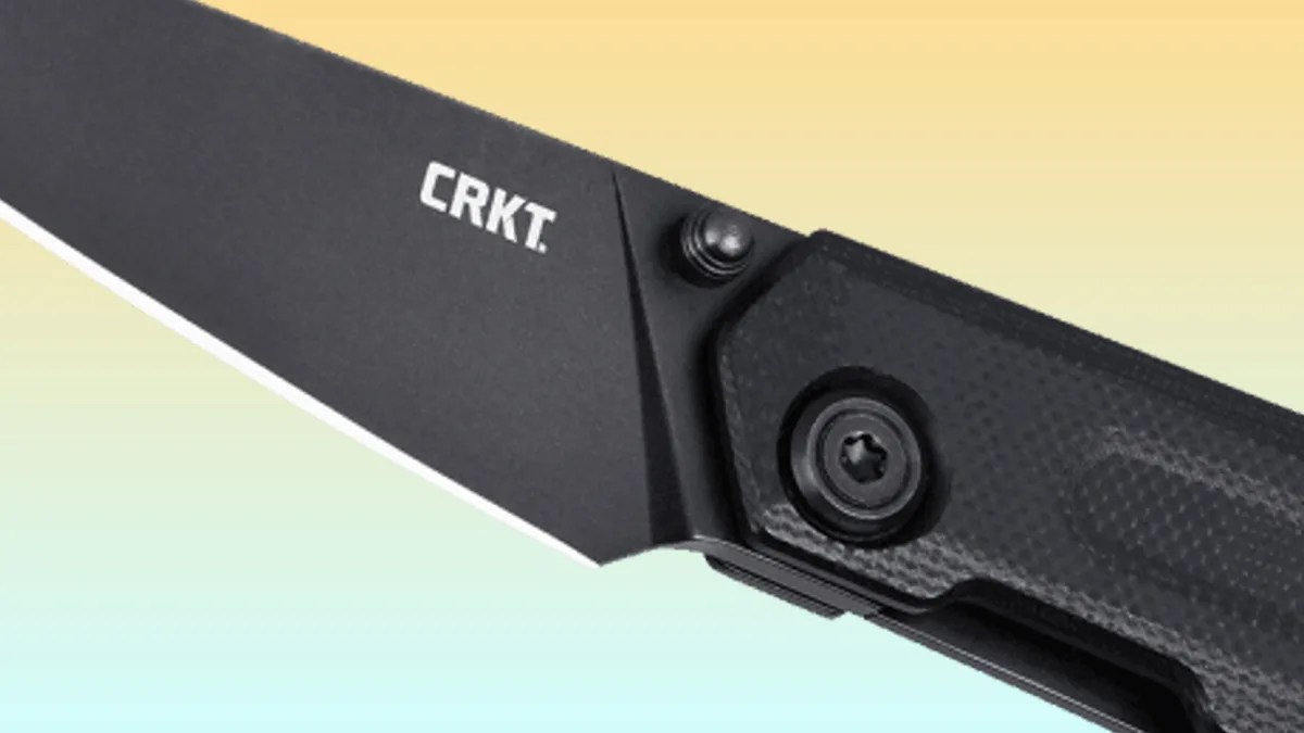 closeup of CRKT 2670 Straight Frame Lock knife on yellow-blue background