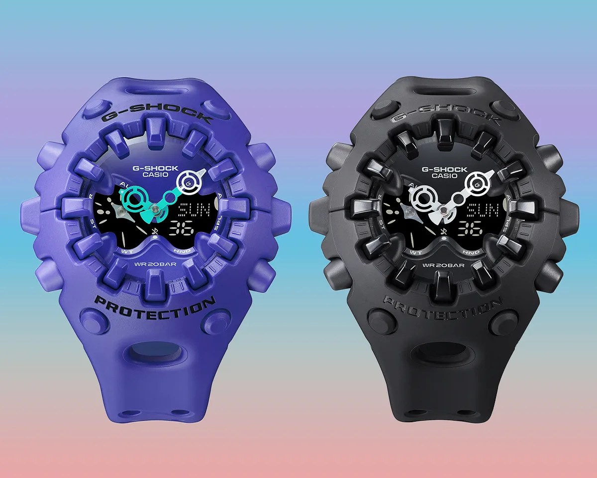 Two Casio G-Shock GA-V01 watches on pastel rainbow background
