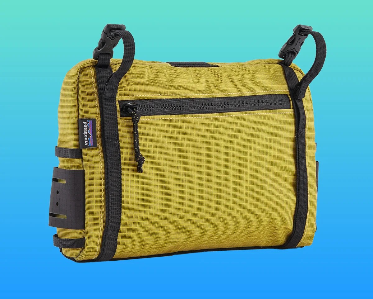 Patagonia Stealth Switch Pack back on blue-green background