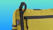 closeup of Patagonia Stealth Switch Pack on blue-green background