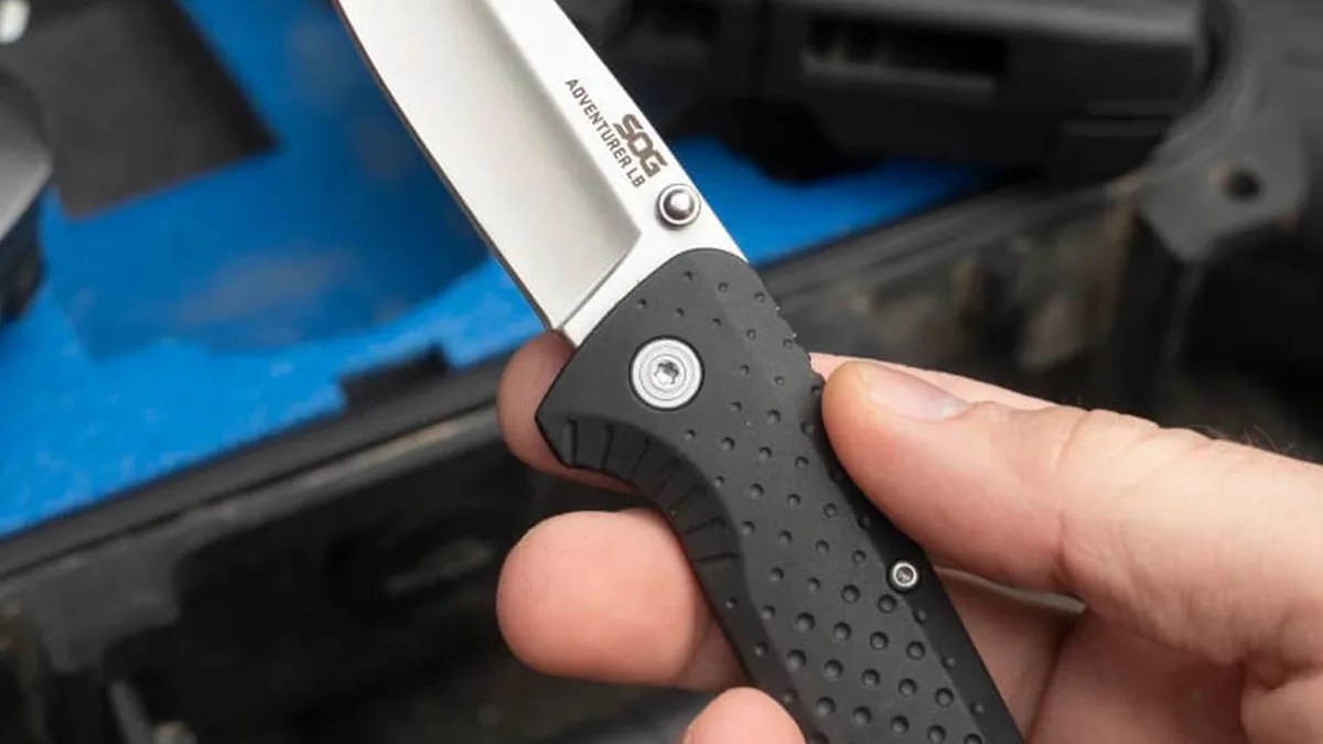 SOG Adventurer LB knife in hand, closeup