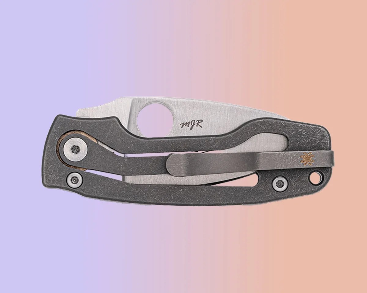 Spyderco PITS 2 Slipit knife closed on pink-purple background