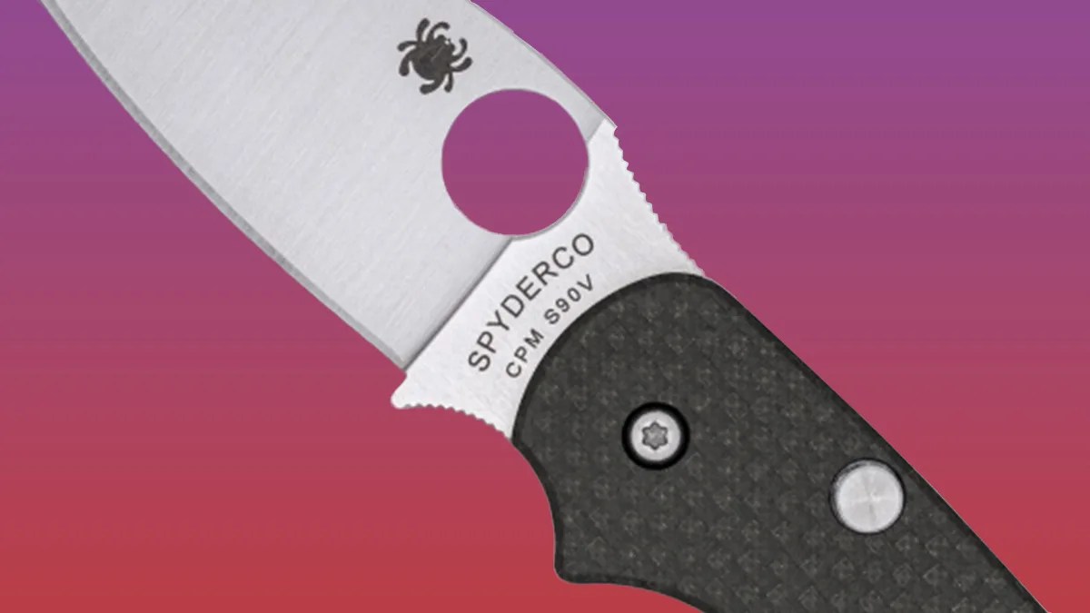 Closeup of Spyderco Sage 6 Button Lock knife on pink-purple background