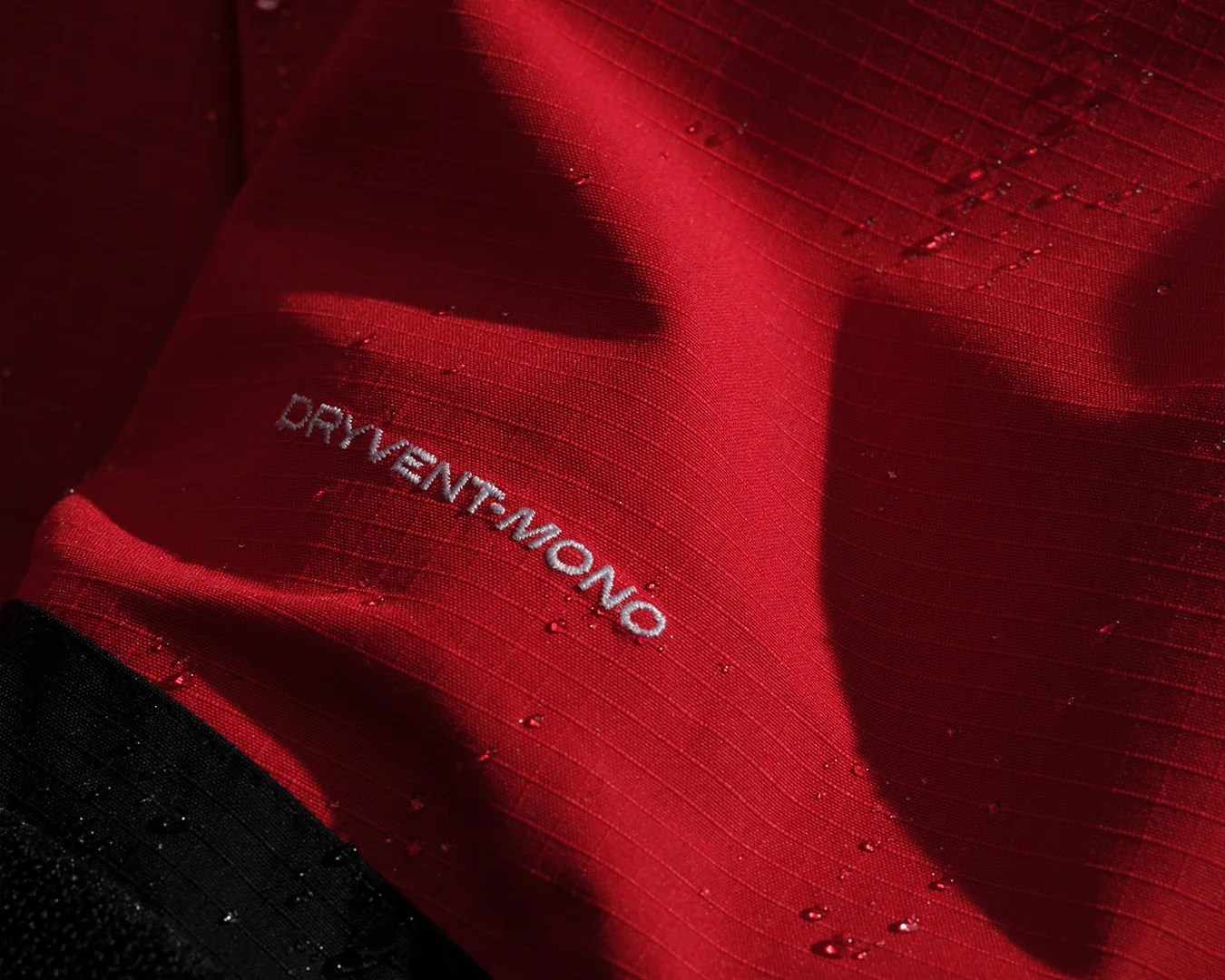 The North Face Mono Jacket in red waterproof detail