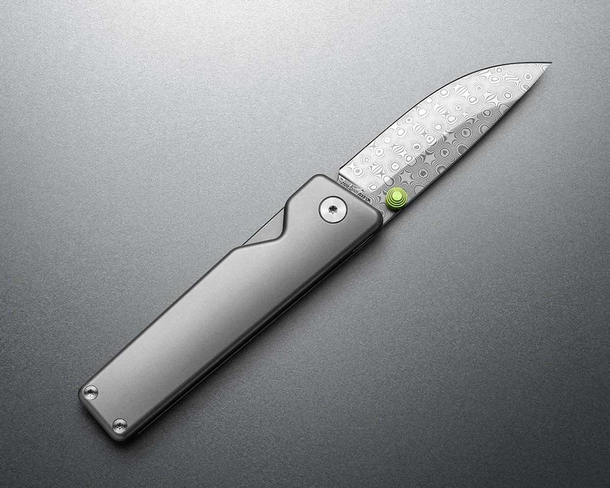 The James Brand Chapter 2 Rose Damasteel knife on gray background