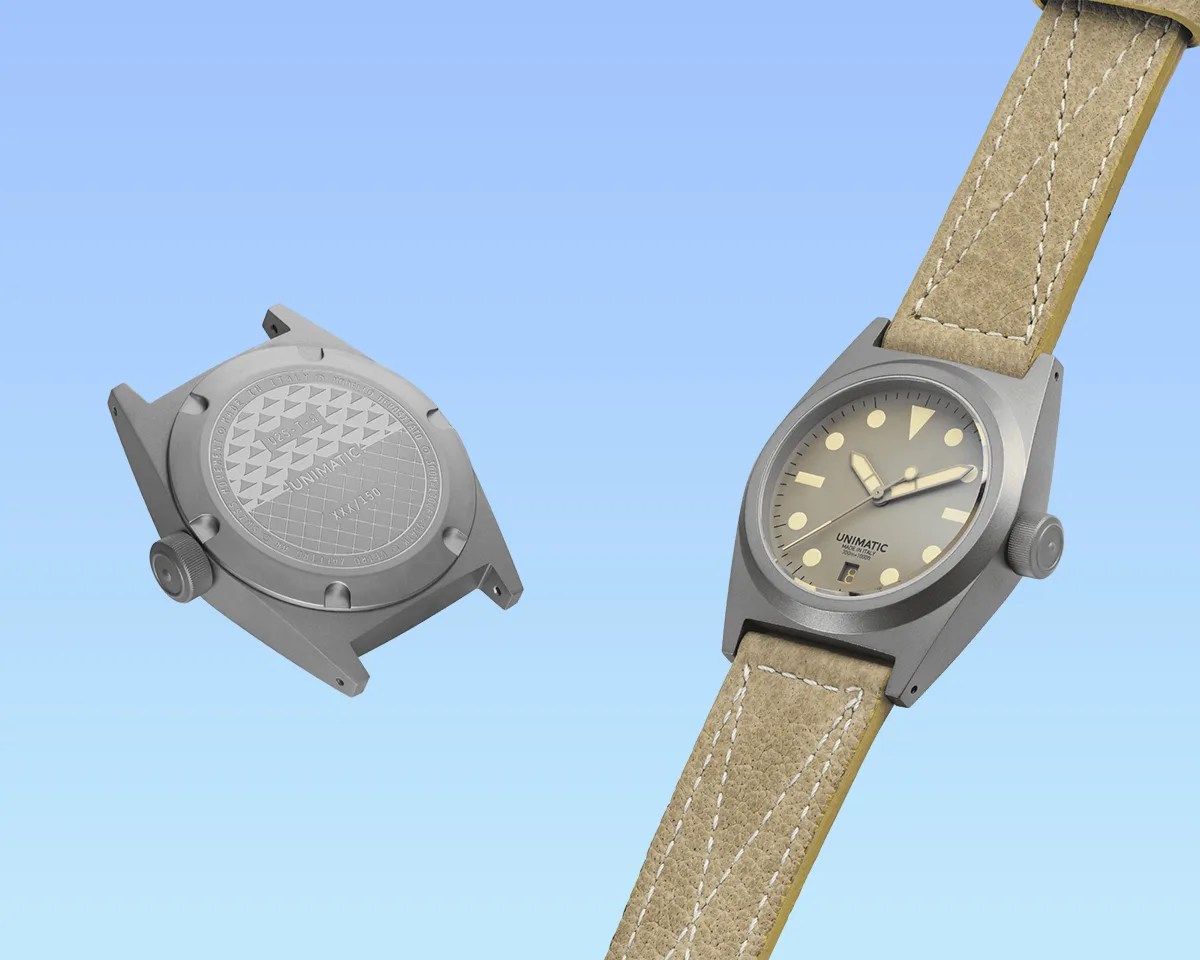 two Unimatic Modello Due U2S T W Field Watches on blue background