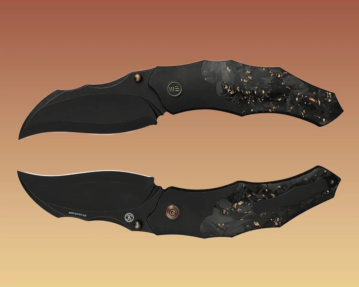 two We Knife Orc Boss knives, front and back, on yellow-brown background