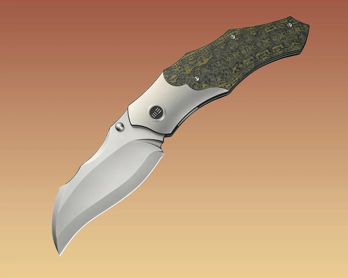 We Knife Orc Boss knife on yellow-brown background