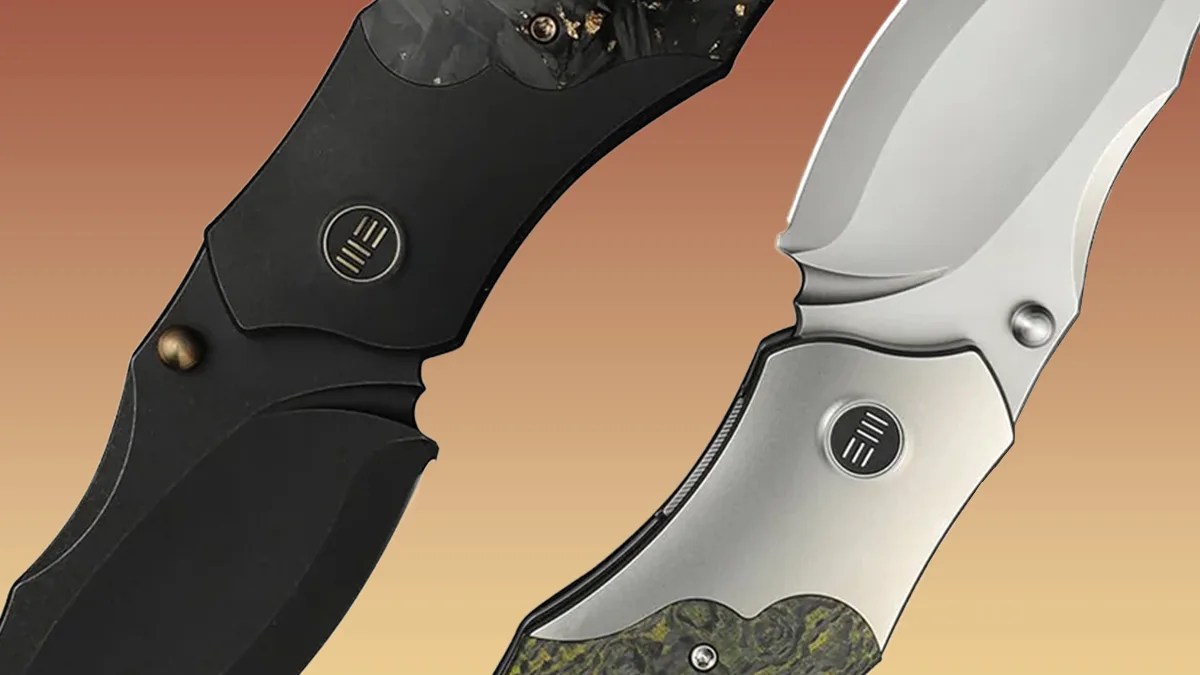 closeup of We Knife Orc Boss knives on yellow-brown background
