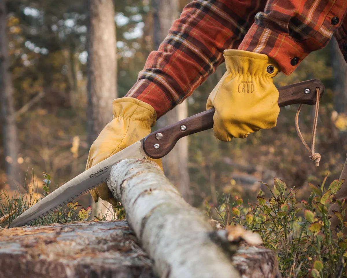 Woxna Folding Saw being used to saw log