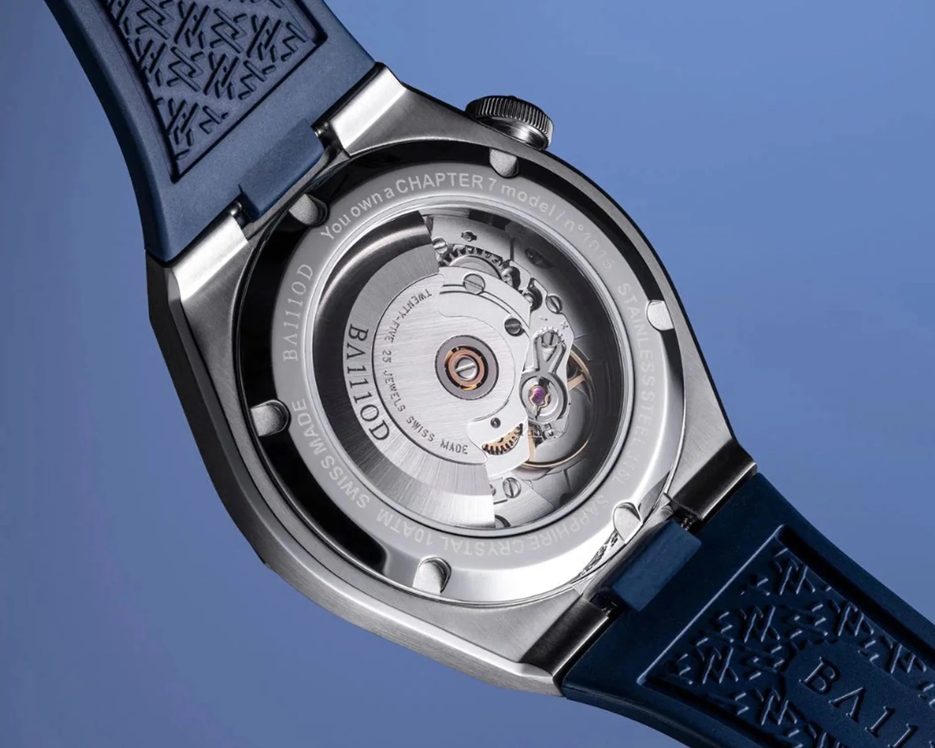 the exhibition case back and movement on a steel watch