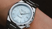 a steel Ba111od Chapter 7 watch on a man's wrist