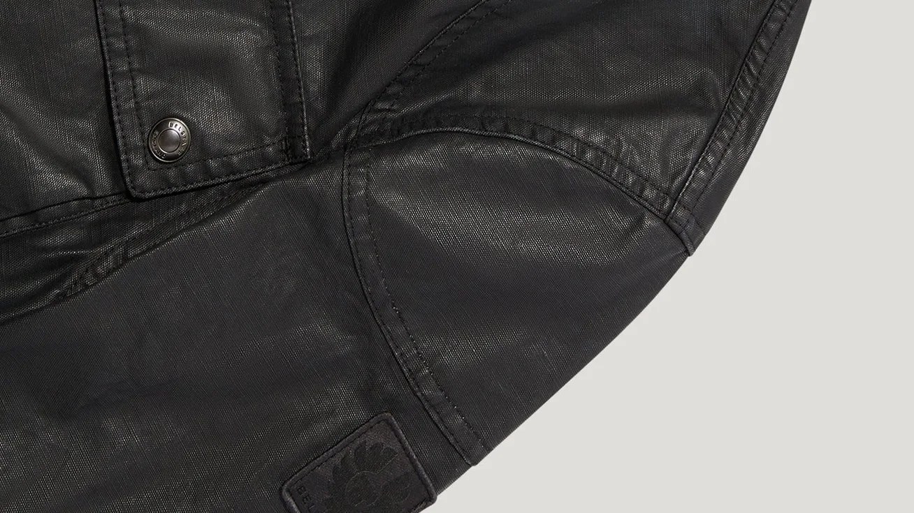 the shoulder of a black moto jacket