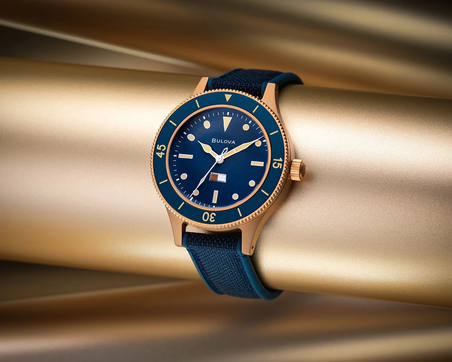 a bulova dive watch on a bronze pipe
