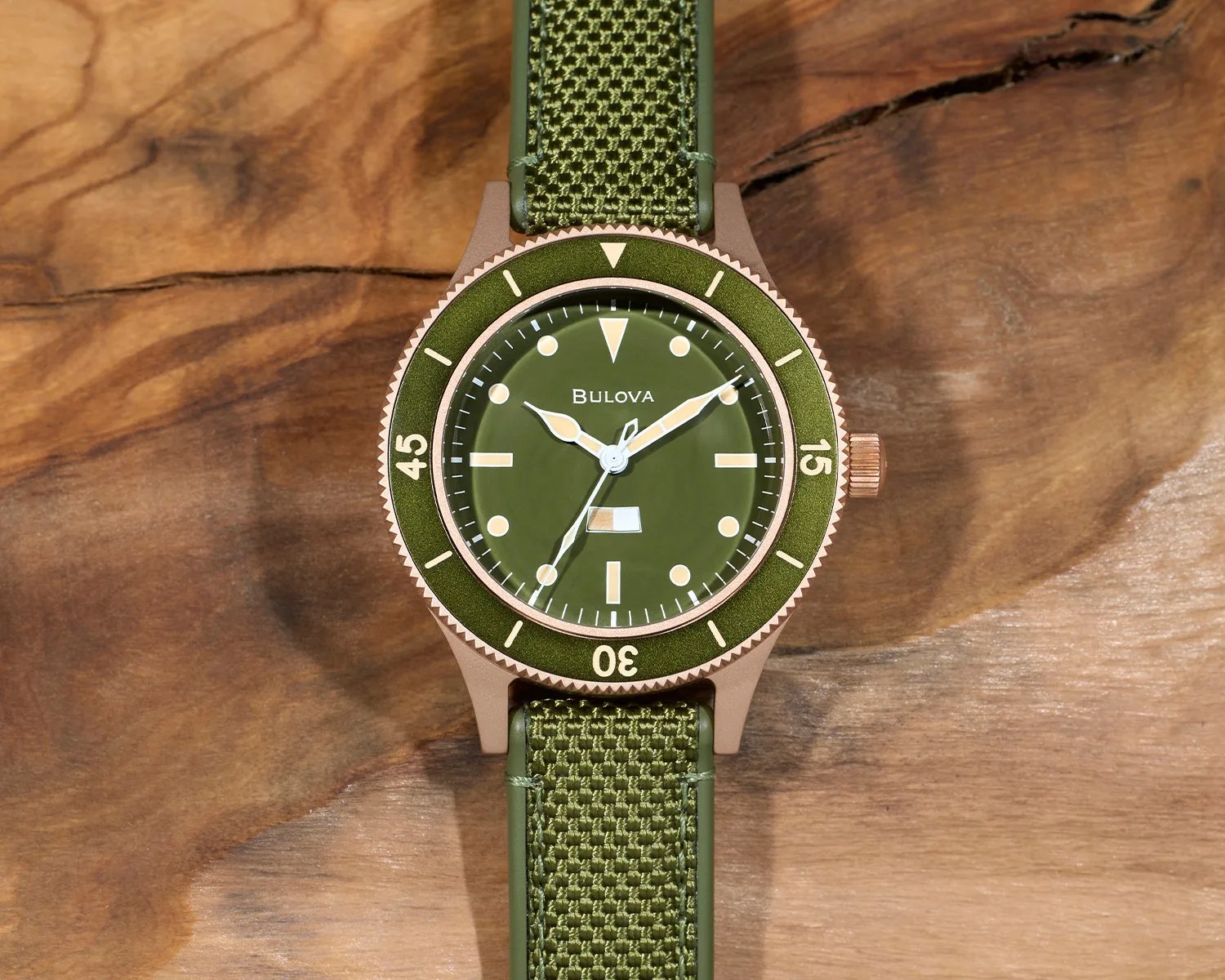 a bulova dive watch on a wooden surface