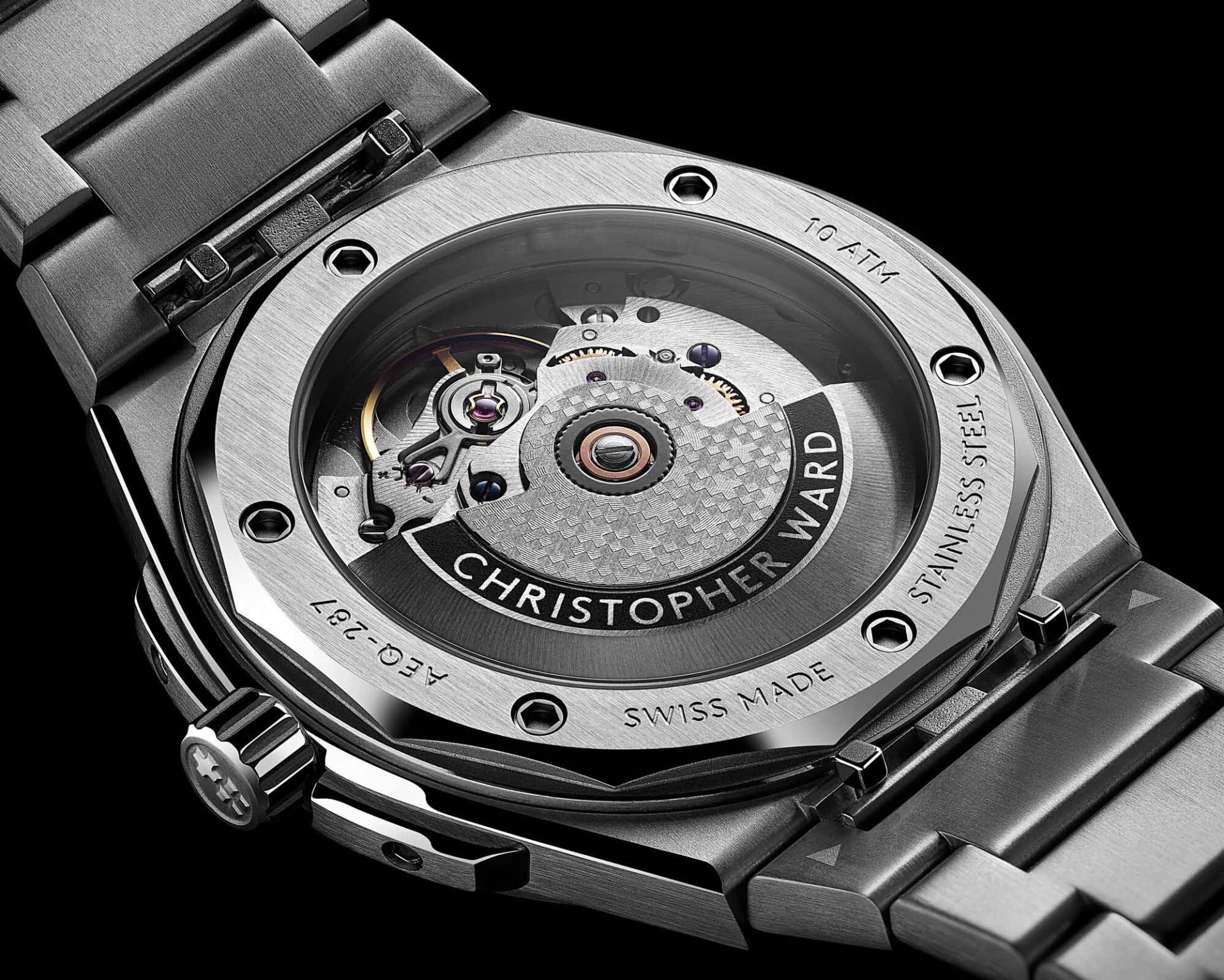 the exhibition case back of a steel watch, which displays the movement