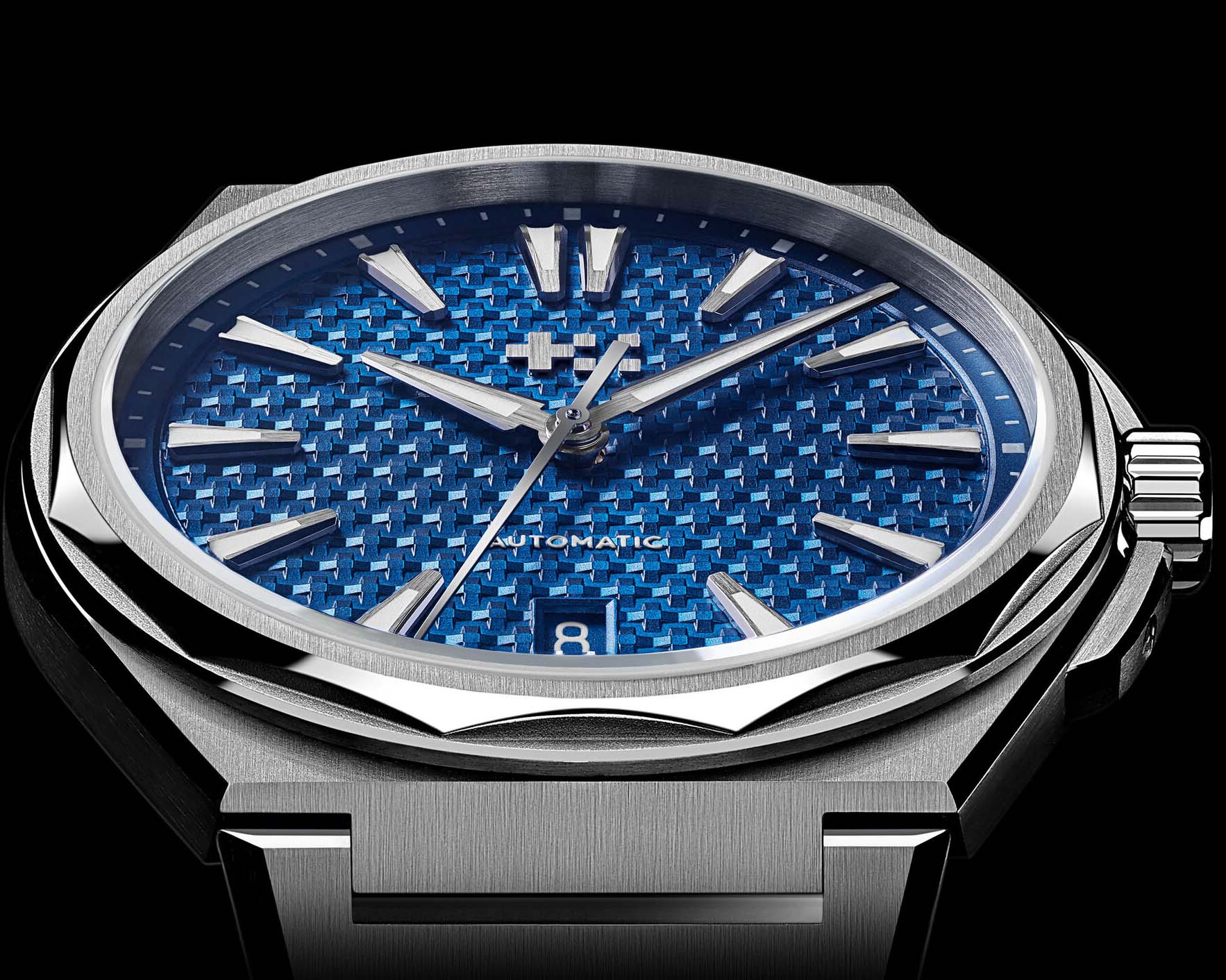 the bezel and dial of a steel watch with a blue dial