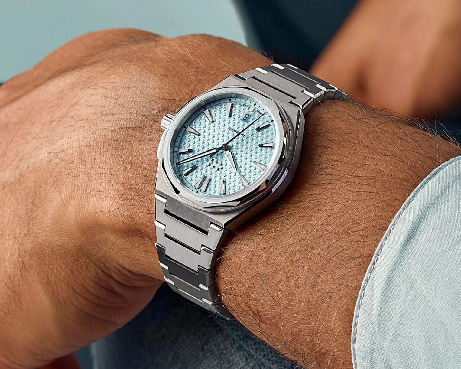 a steel watch on a man's wrist
