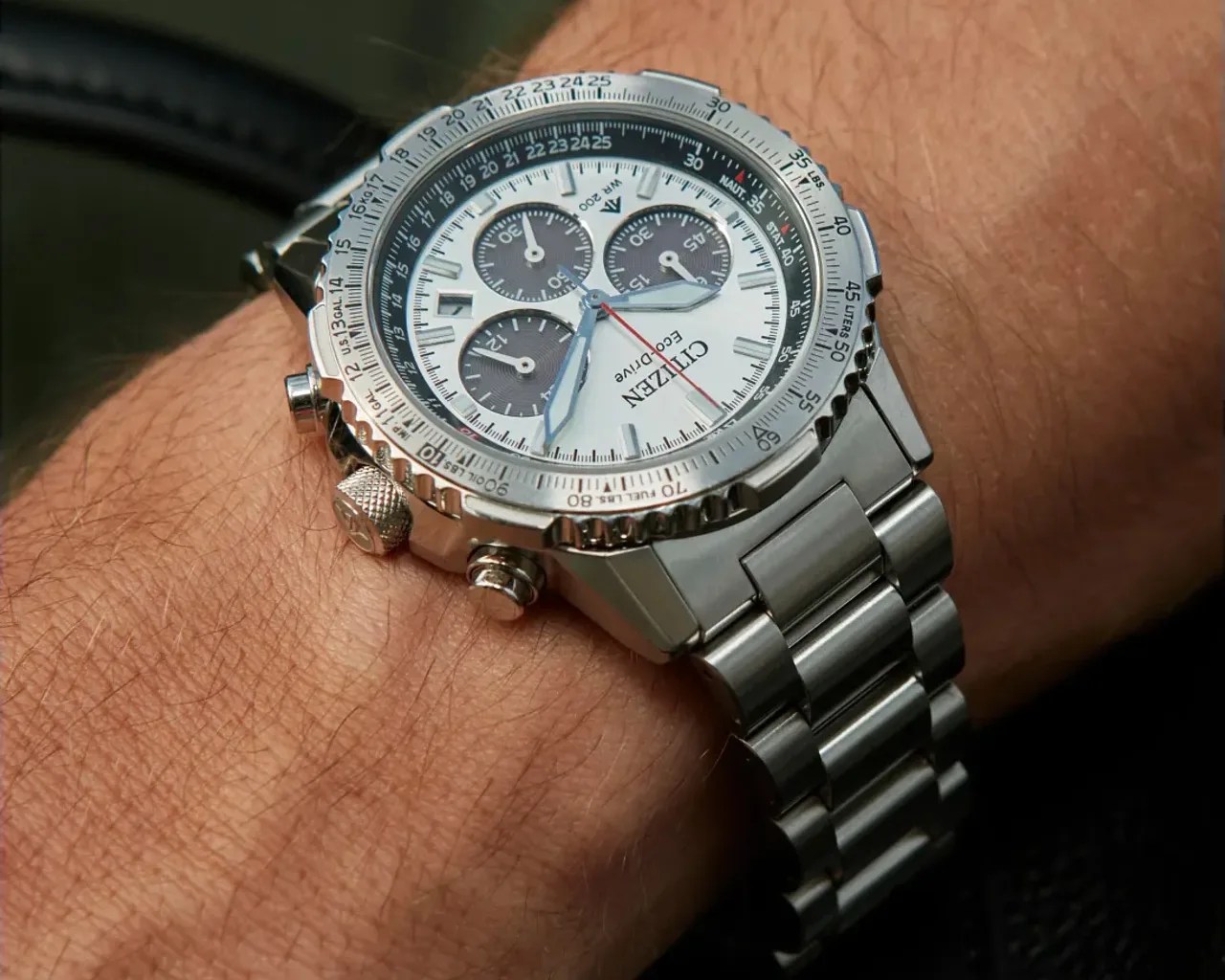 a silver chronograph watch on a man's wrist