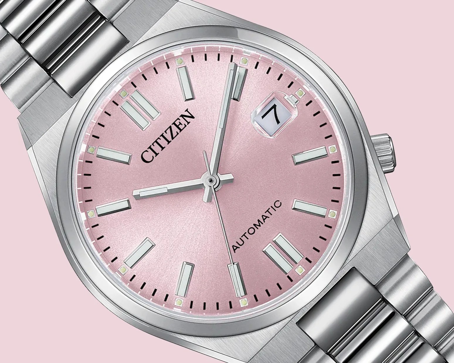 a steel watch with a pink dial