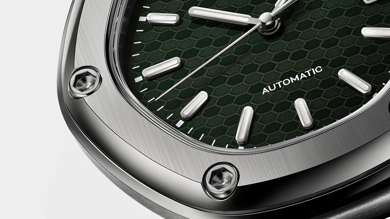 close up of a green dial on a titanium watch