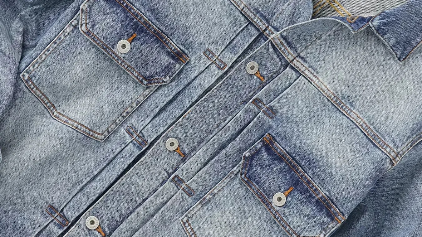 close up of the buttons and pockets of a flint and tinder type 2 denim jacket
