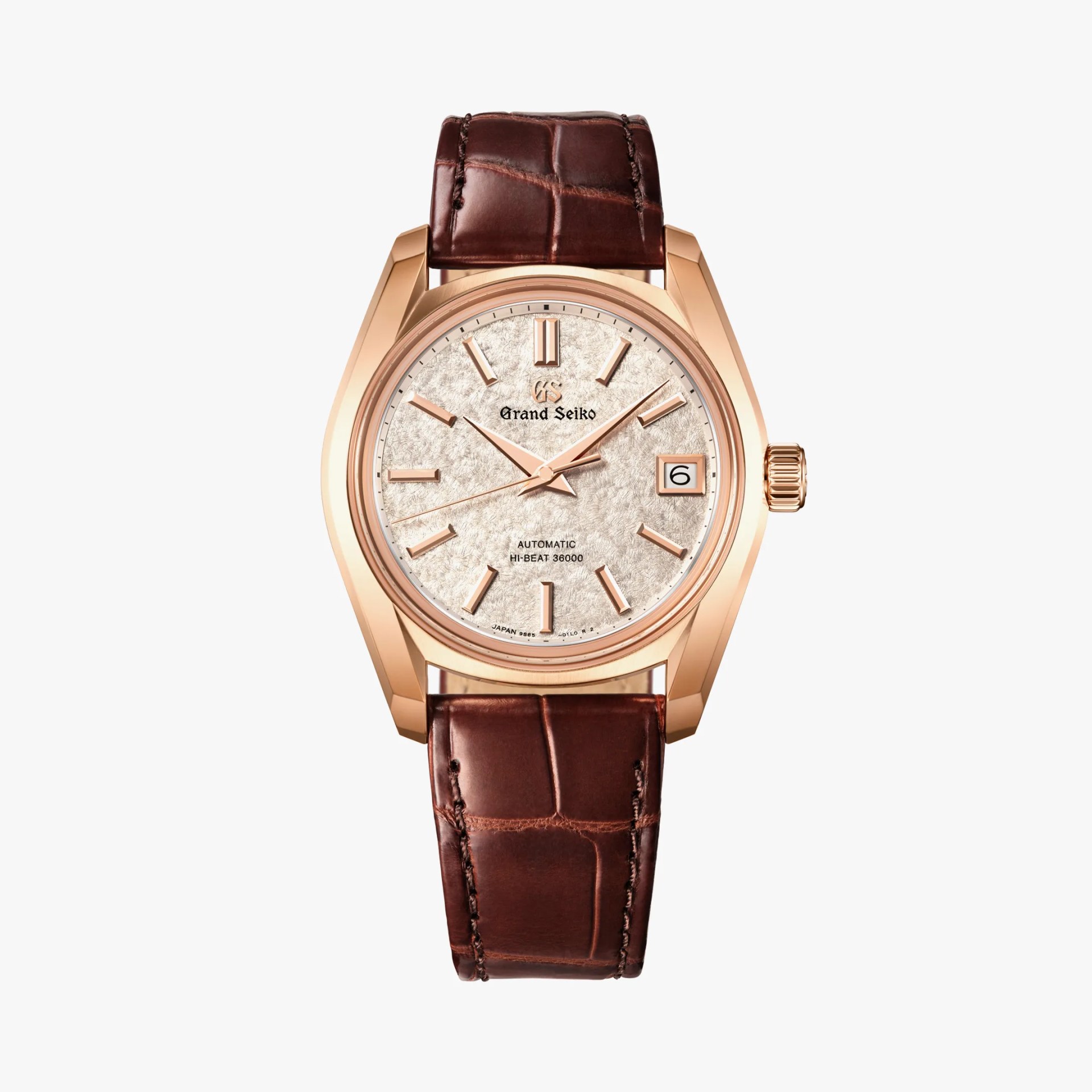 a gold Grand Seiko watch with a brown leather band
