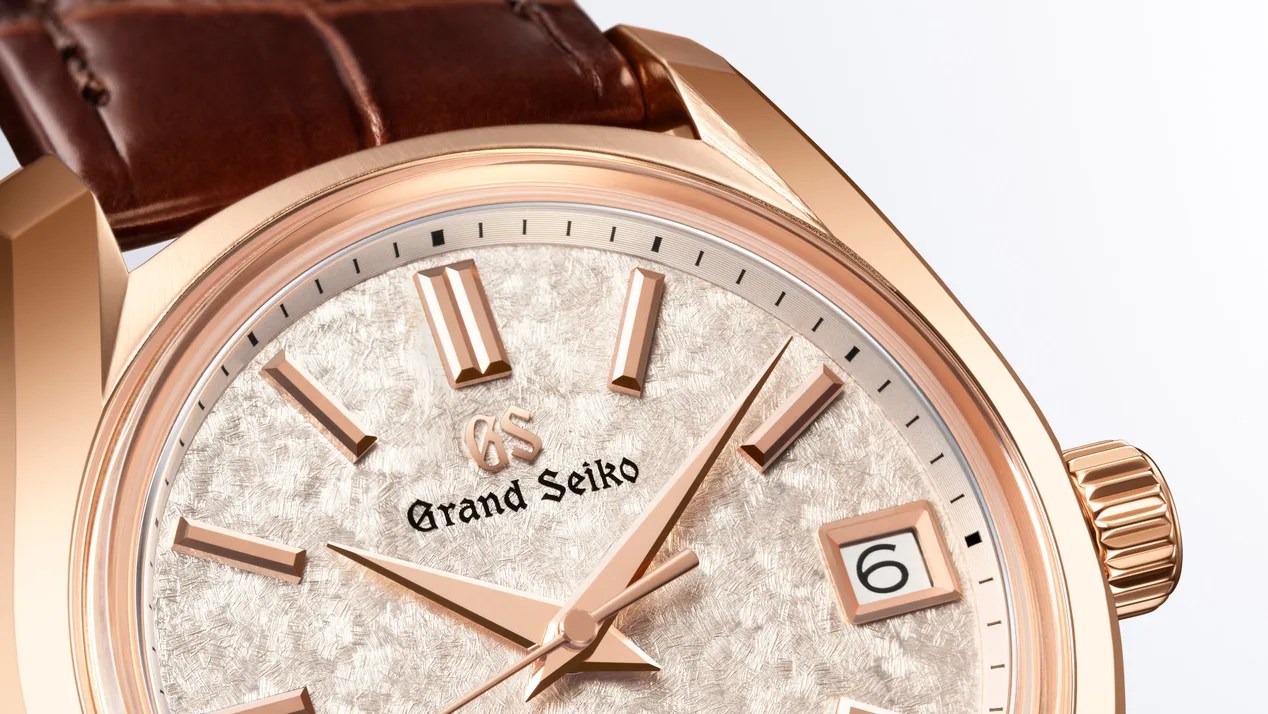 the dial of a gold Grand Seiko watch